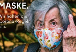 Dito medio rivolto ai “no-mask”: a Berlino è polemica per uno spot pubblicitario