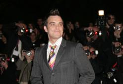 Robbie Williams vince il primo round con Jimmy Page
