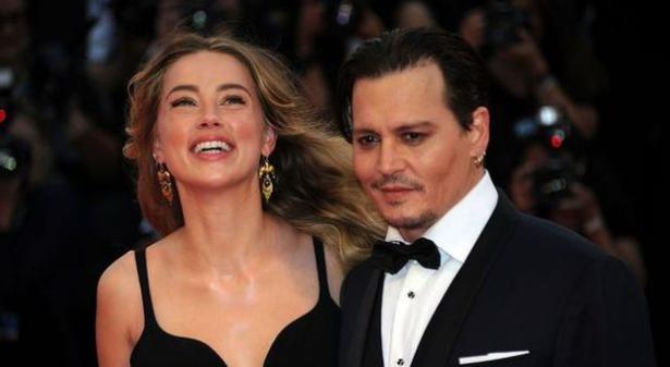 In compagnia della moglie Amber Heard
